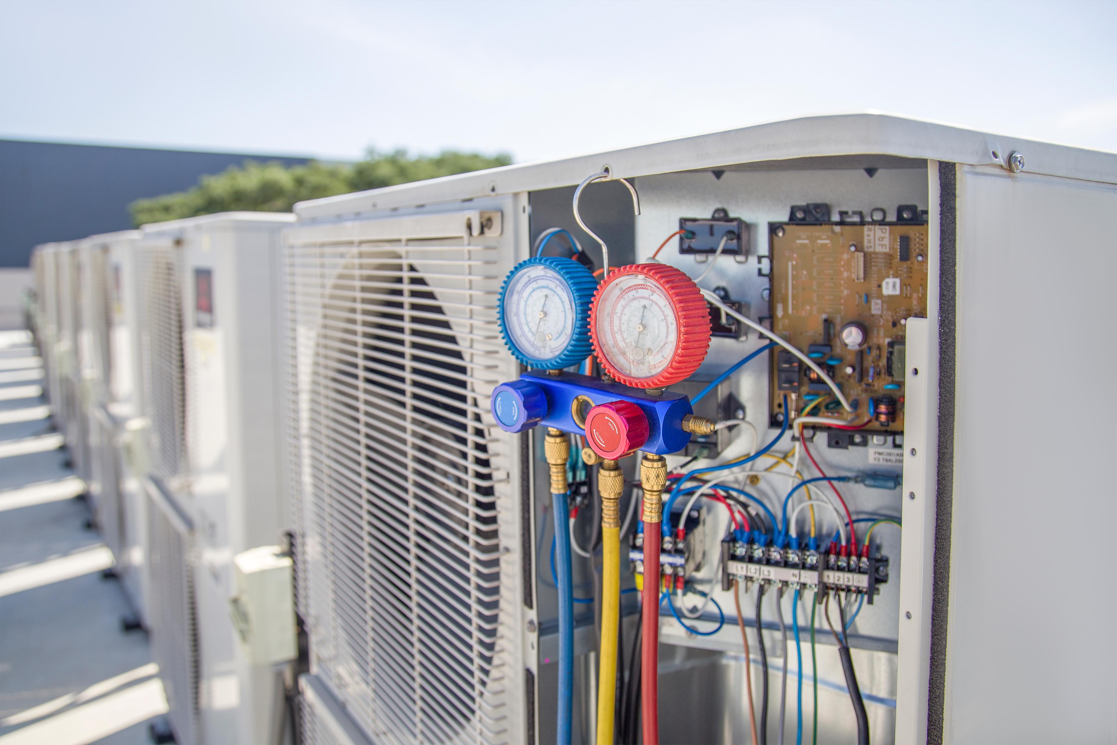 HVAC technician servicing equipment